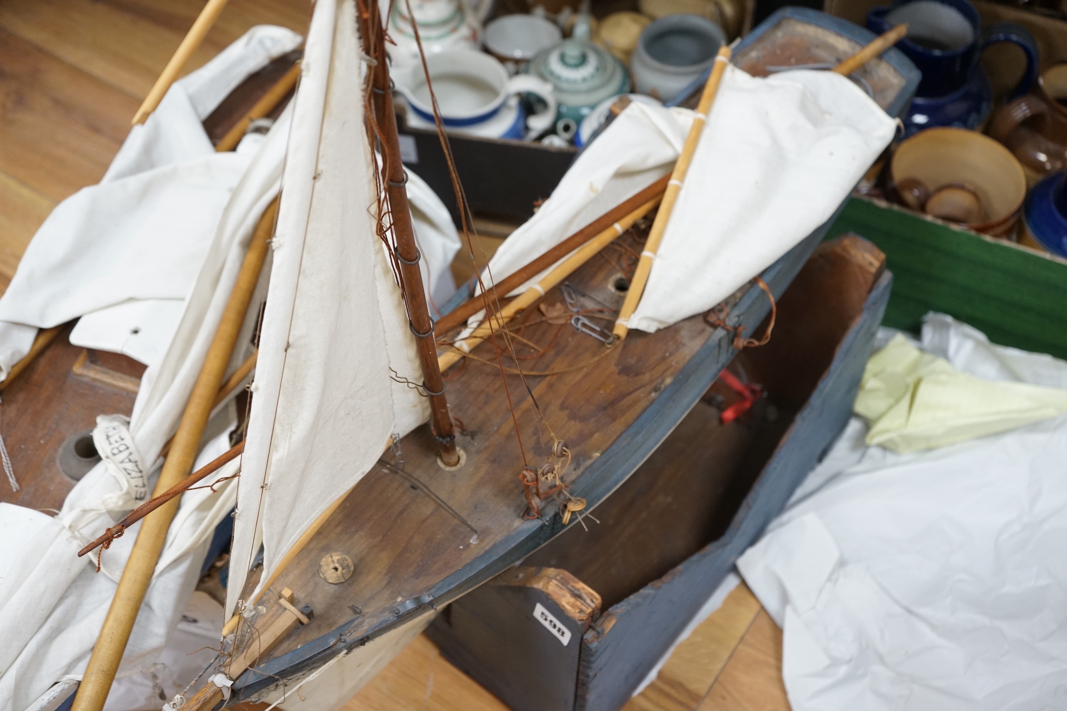 Two large over-painted pond yachts, largest 91cms